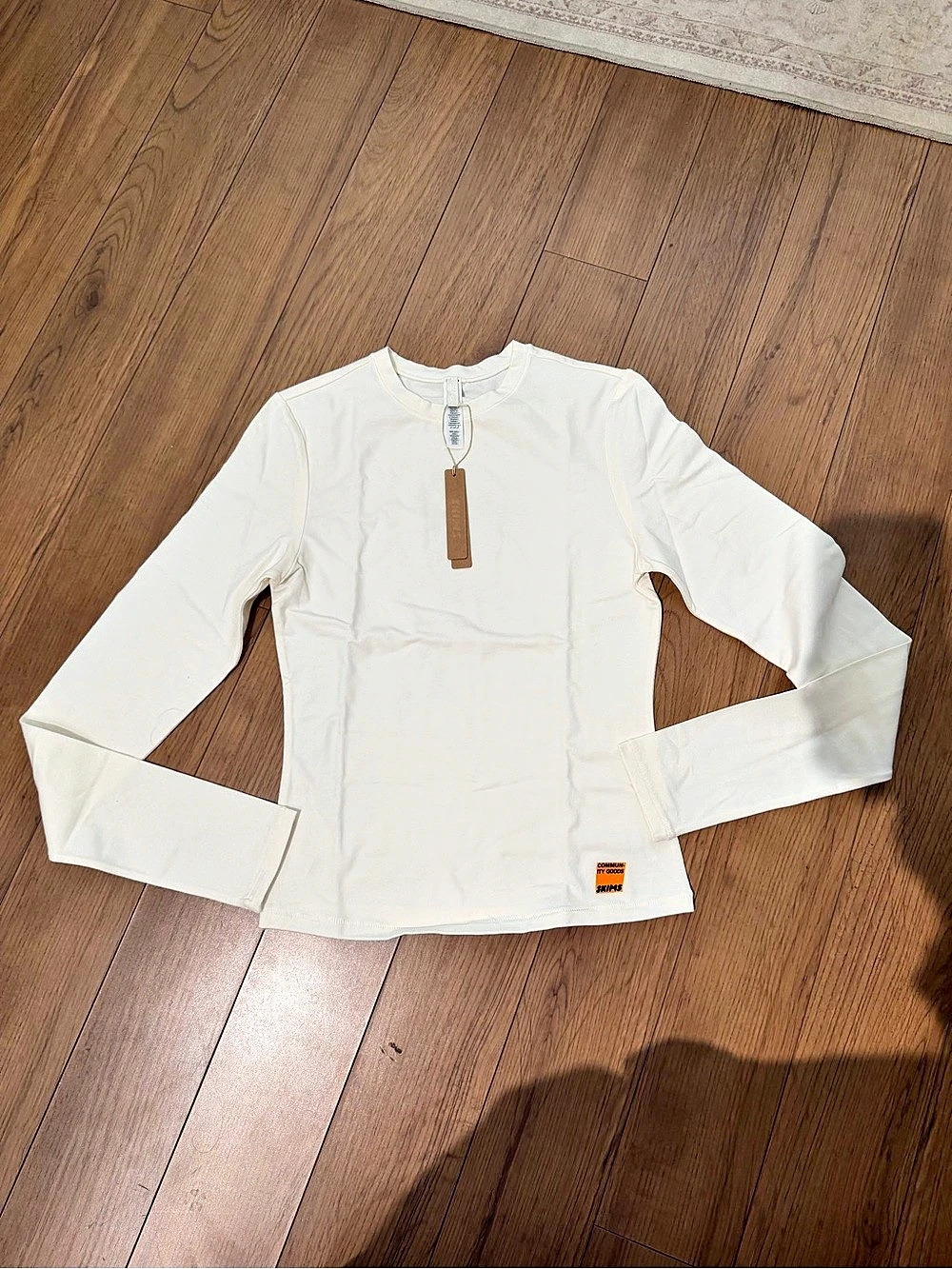 SKIMS X COMMUNITY GOODS white cotton jersey long sleeve t shirt